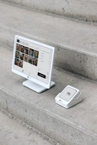 A computer monitor sitting on top of a set of stairs
